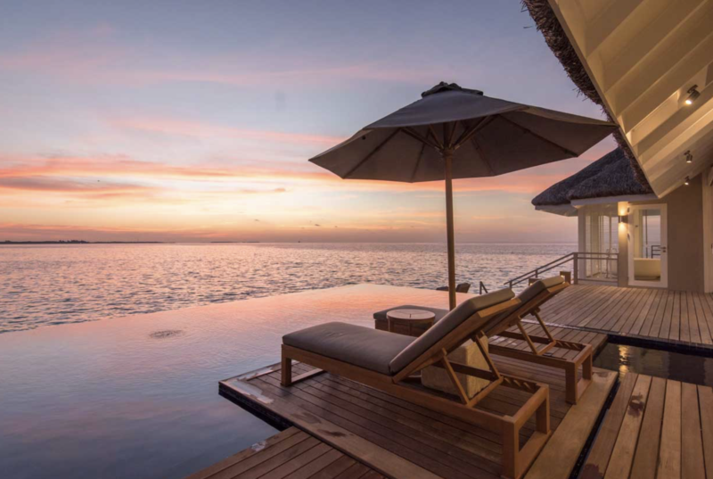 Lux Maldives overwater villa sunset